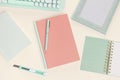 Flat lay old rose book and green stationery Royalty Free Stock Photo