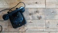 Flat lay of old rotary black antique vintage telephone on wood background copy space historical communication Royalty Free Stock Photo