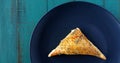 Flat lay of one Triangular Burekasin served on a plate Royalty Free Stock Photo