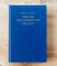 Flat lay open Bible, Greek New Testament. On wooden background. Baselland, Switzerland 12.05.2019