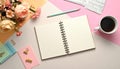 Flat lay of open notebook, coffee, and flowers Royalty Free Stock Photo