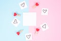 Flat lay out with white paper sticker place for text and bright hearts around