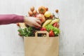 Flat lay paper bag different health food white wooden background Royalty Free Stock Photo