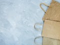 Flat lay of paper wastes as bags, boxes ready for recycling on gray background. Ecology care and social responsibility concept Royalty Free Stock Photo