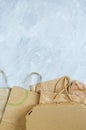 Flat lay of paper wastes as bags, boxes ready for recycling on gray background. Ecology care and social responsibility concept Royalty Free Stock Photo