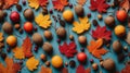 Flat lay pattern with colorful autumn leaves, acorns and berries on a color background