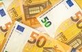 Flat lay pattern of 50 euro cash banknotes. Money background for financial and economy topics.