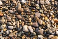 Flat lay of pebbles pattern on the sea shore Royalty Free Stock Photo