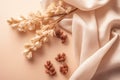 flat lay photo of beige scarf and dried flowers. background