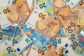 Flat lay photo of a many chaotically lying twentys and fiftys euro banknotes