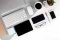 Flat lay photo of Office table with keyboard, notebook, digital tablet, mobile phone, Pencil, eyeglasses on modern two tone Royalty Free Stock Photo