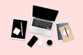 Flat lay photo of office table with laptop computer, digital tablet, mobile phone and accessories. on modern pink tone background. Royalty Free Stock Photo
