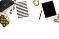 Flat lay photo of stylish office white desk with wallet, Women`s jewelry, keyboard and gold notebook copy space background Royalty Free Stock Photo