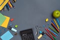 Flat lay photo of workspace desk with school accessories or office supplies on gray background. Royalty Free Stock Photo