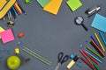 Flat lay photo of workspace desk with school accessories or office supplies on gray background. Royalty Free Stock Photo