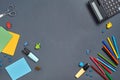 Flat lay photo of workspace desk with school accessories or office supplies on gray background. Royalty Free Stock Photo