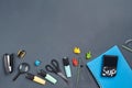 Flat lay photo of workspace desk with school accessories or office supplies on gray background. Royalty Free Stock Photo