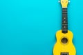 Flat lay photo of yellow ukulele with copy space Royalty Free Stock Photo
