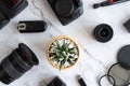 Flat lay of photography equipment on white marble background: dslr camera and lens. Photographer workspace concept. Top view Royalty Free Stock Photo