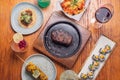 Flat lay photography of various food plates and cocktails