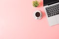 Flat lay of pink office desk table or workplace with laptop and coffee Royalty Free Stock Photo