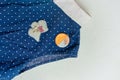 Flat lay of polka dot blouse and brooch. Royalty Free Stock Photo