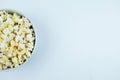 Flat lay of pop corn bowl on a white background,Top view