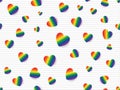 Flat lay of rainbow colored hearts scattered on light grey and white striped background. Seamless pattern vector illustration