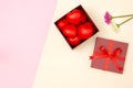 Flat lay of red heart in gift box and flowers Royalty Free Stock Photo