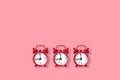 Flat lay retro beautiful new alarm clock on a pink background. Copy space Royalty Free Stock Photo