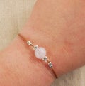 Flat lay rose quartz bracelet Royalty Free Stock Photo