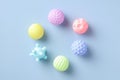 Flat lay rubber kid toys balls for bath on blue background. Minimal style Royalty Free Stock Photo