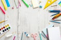 Flat lay school supplies on wooden desk table. Frame made of school stationery, copy space, top view. Back to school concept Royalty Free Stock Photo