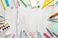 Flat lay school supplies on wooden desk table. Frame made of school stationery, copy space, top view. Back to school concept Royalty Free Stock Photo