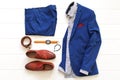 Flat lay set of classic mens clothes such as blue suit, brown sh