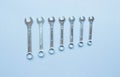 top view of set of spanners and wrench on blue grey background. Repairing tools Royalty Free Stock Photo