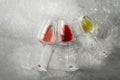 Flat lay set of wine in glasses white, rose, red on a gray concrete background. View from above Royalty Free Stock Photo