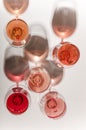 Glasses of white and pink wine with their shadows Royalty Free Stock Photo