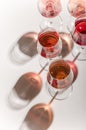 Glasses of white and pink wine with their shadows Royalty Free Stock Photo