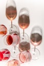 Glasses of white and pink wine with their shadows Royalty Free Stock Photo