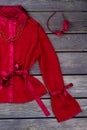 Flat lay shot of polyester satin lycra fabric red jacket.