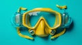 flat lay shot of yellow diving mask with snorkel blue background