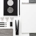 Flat lay skretch book mockup with black frame and office supplies on white  background. Top view mockup. Royalty Free Stock Photo