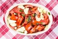 Flat lay sliced tomato and young onions salad on the table Royalty Free Stock Photo
