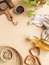 Flat lay of small bowls various dry spices, wood kitchen utensils, fresh mint in pot olive oil in glass bottle on beige background Royalty Free Stock Photo