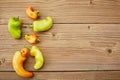 Flat lay Some ugly curved bent chilli peppers on white wooden background