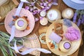 Flat lay spa accessories, handmade artisan soap, fresh flowers, wisp of bast, candles, bath salt Royalty Free Stock Photo