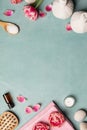 Flat lay of spa treatment set with pink flowers Royalty Free Stock Photo