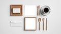 Flat lay of stationery and cutlery on white background Royalty Free Stock Photo