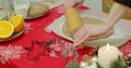 Flat lay. Step by step. Rolling out gingerbread cookie dough to bake Christmas cookies. Royalty Free Stock Photo